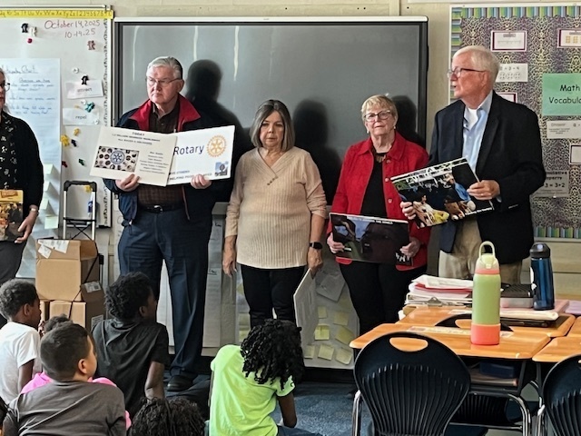 Rotary Club members presenting to third grade students. 