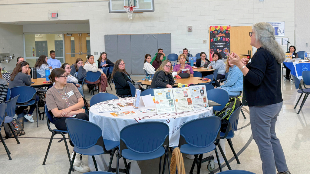 Community partner introducing themself and their organization to the new teachers.