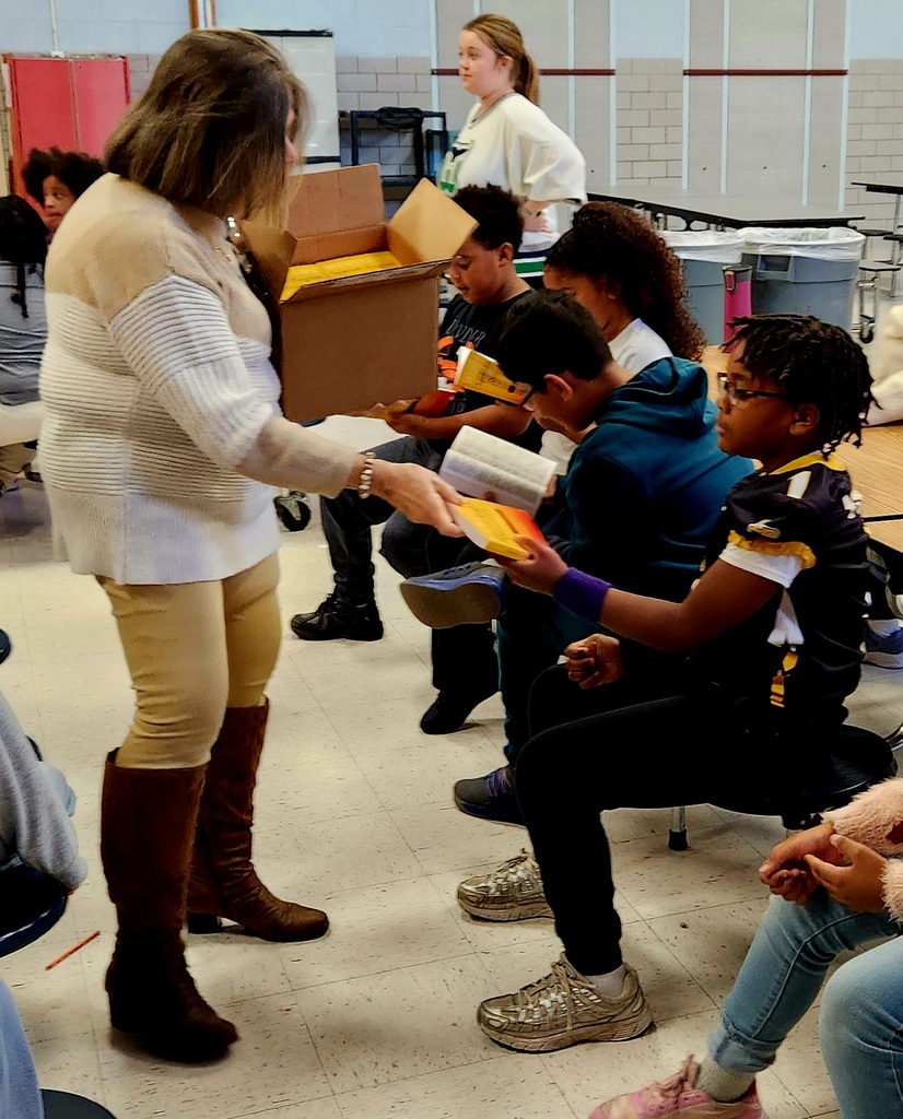 Third graders receive Spanish/English dictionaries from the Norristown Rotary Club.