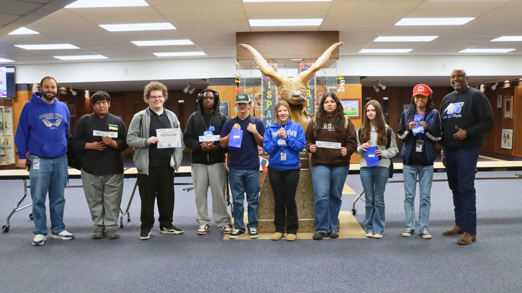 Students and staff pose for a photo.
