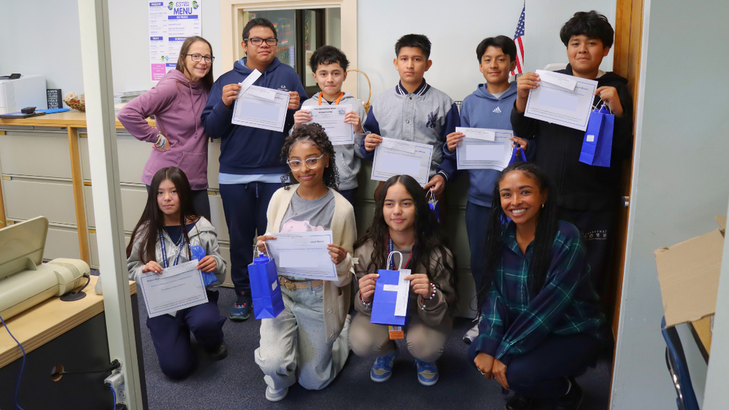 Students and staff pose for a photo.