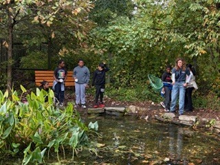 Fourth graders explore the pond at Riverbend.