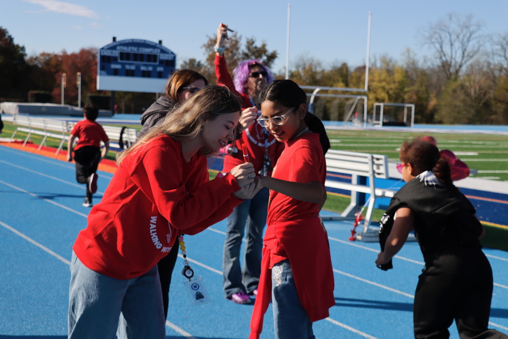 Cole Manor 4th Grade student getting their stamp at the Walk - A - Thon.