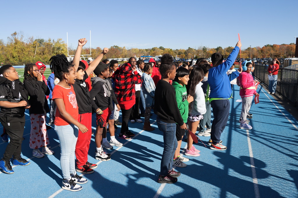 4th Grade Students Performing a Song at the Walk - A - Thon.