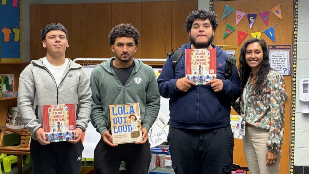 Students and teacher pose for a phot during their elementary visit.