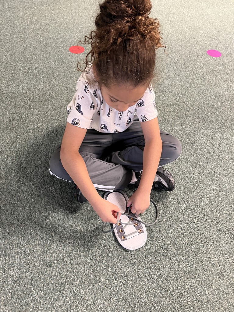 A 1st Grader with their practice shoe.