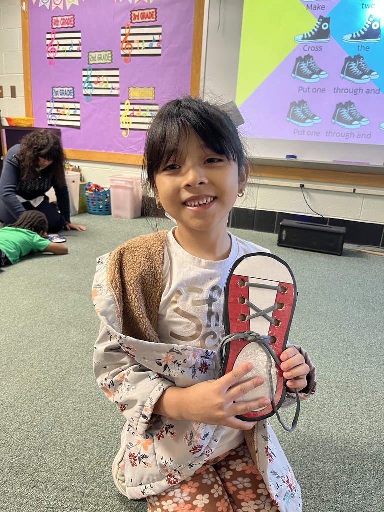 A 1st Grader with their practice shoe.