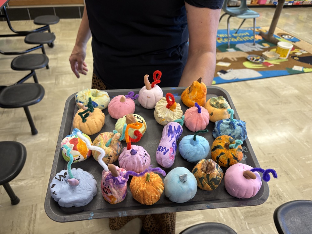 Student pumpkins made out of clay using form, color, and texture.