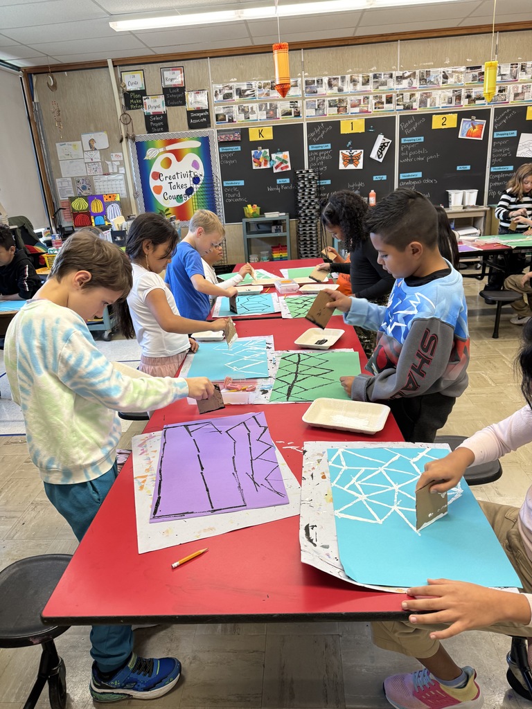 Third graders create a printed background for their art projects.