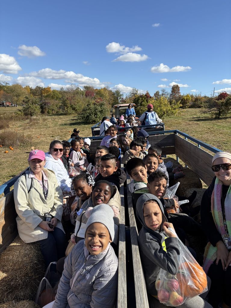 Students, teachers and chaperones on a hayride.