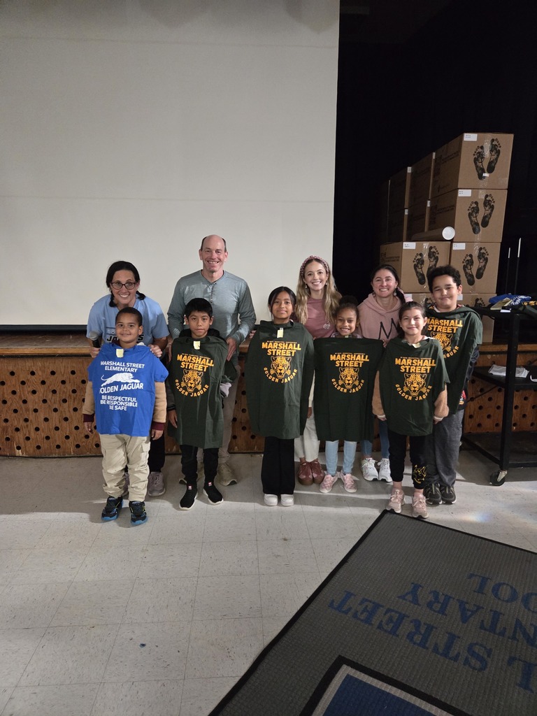 Special area teachers pose with students selected as Golden Jaguars.