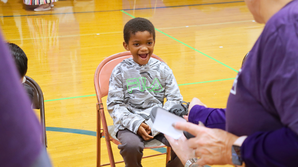 Student's reaction to seeing his new shoes.