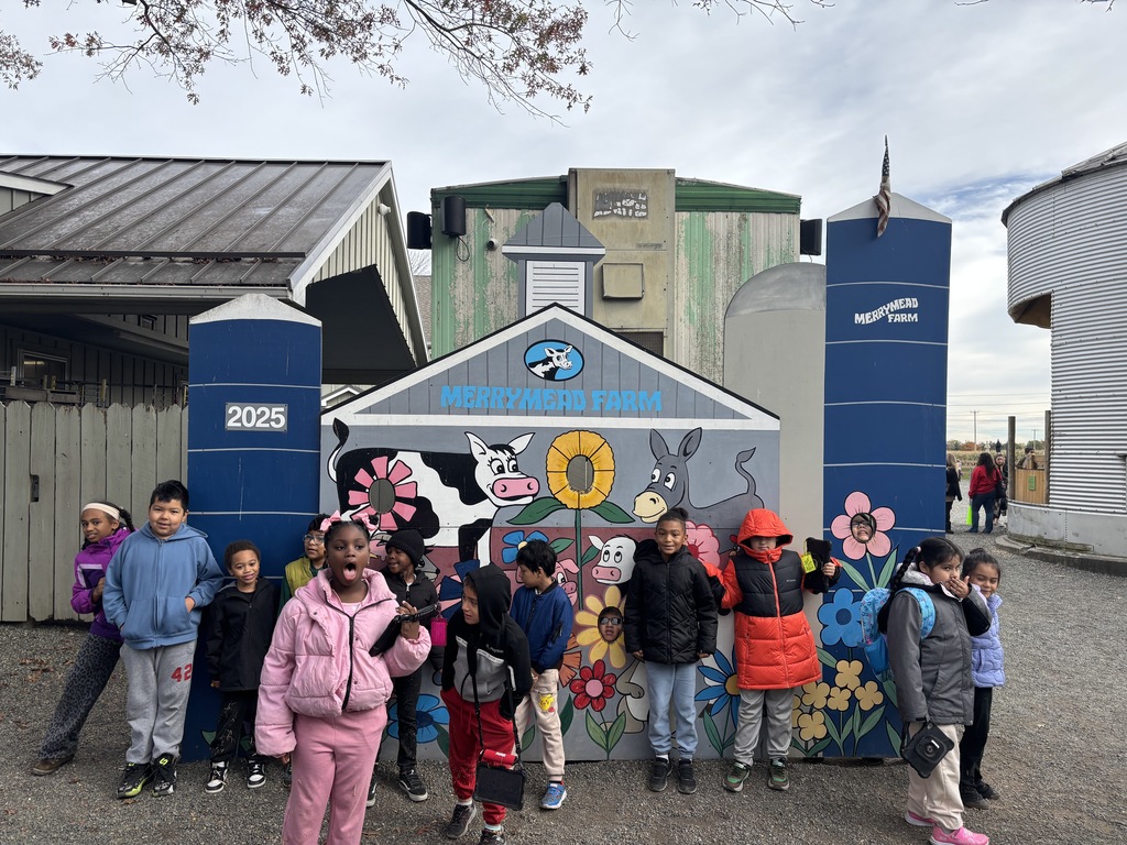 Students posing in front of the barn picture