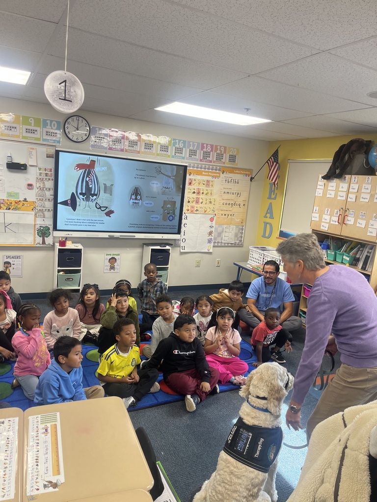 Instructor speaking with service dog