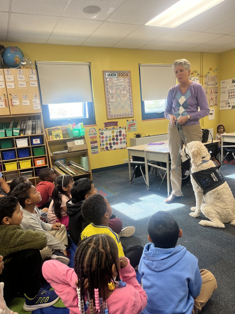 Instructor speaking to class about service dog