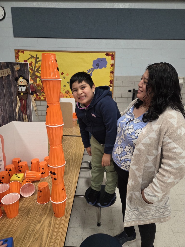 A Kindergartner plays a game at the Fall Fest.