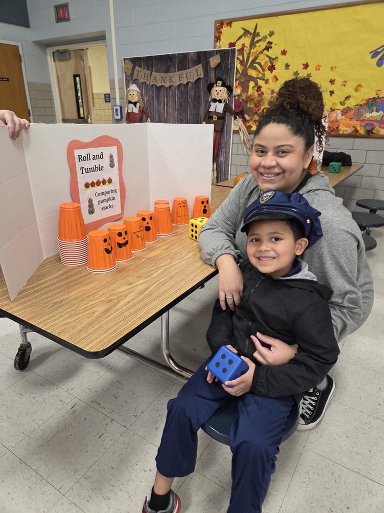 A Kindergartner plays a game at the Fall Fest.