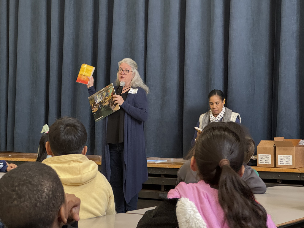 Rotary members presention about the Spanish-English dictionaries they gifted the 3rd Graders.