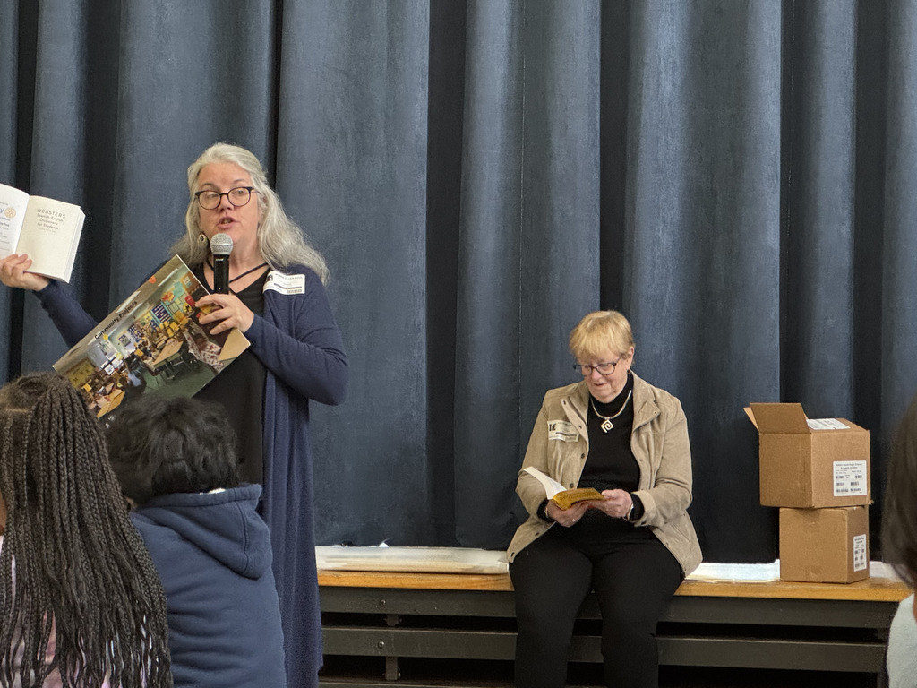 Rotary members presention about the Spanish-English dictionaries they gifted the 3rd Graders.