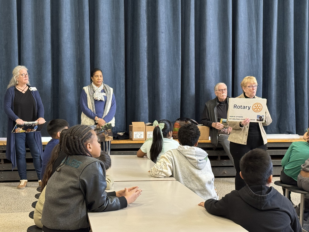 Rotary members presention about the Spanish-English dictionaries they gifted the 3rd Graders.