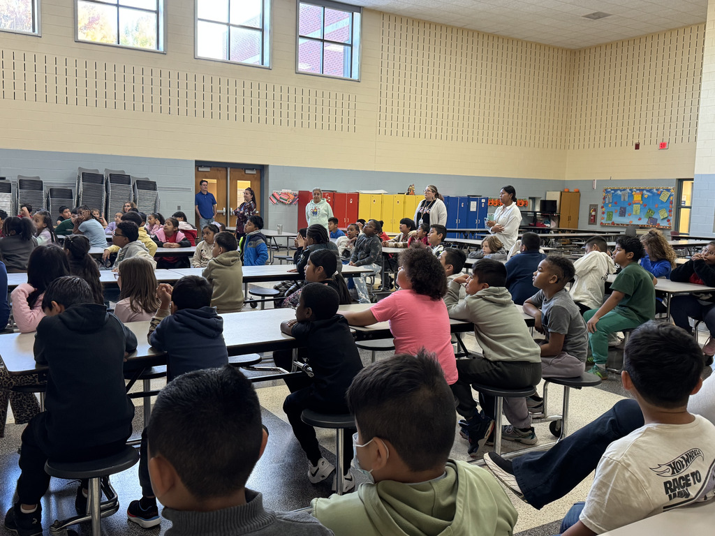 Rotary members presention about the Spanish-English dictionaries they gifted the 3rd Graders.
