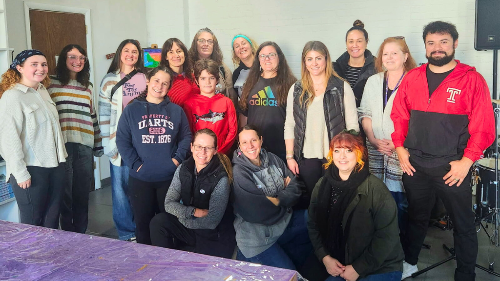 Group of teachers pose for a photo.