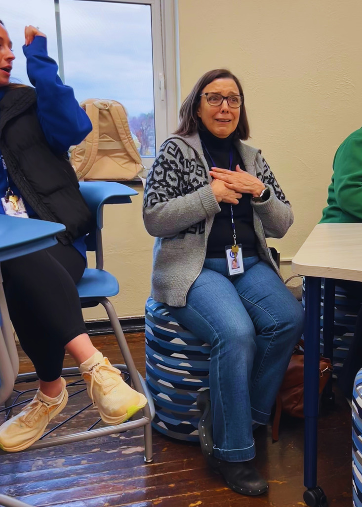 The community liaison is surprised to be named the team member of the month