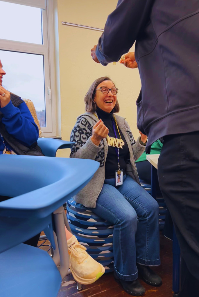 The community liaison is being crowned the team member of the month