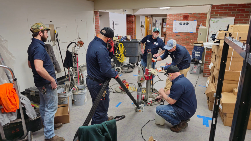 NASD maintenance team working on electrical system in the admin building. 
