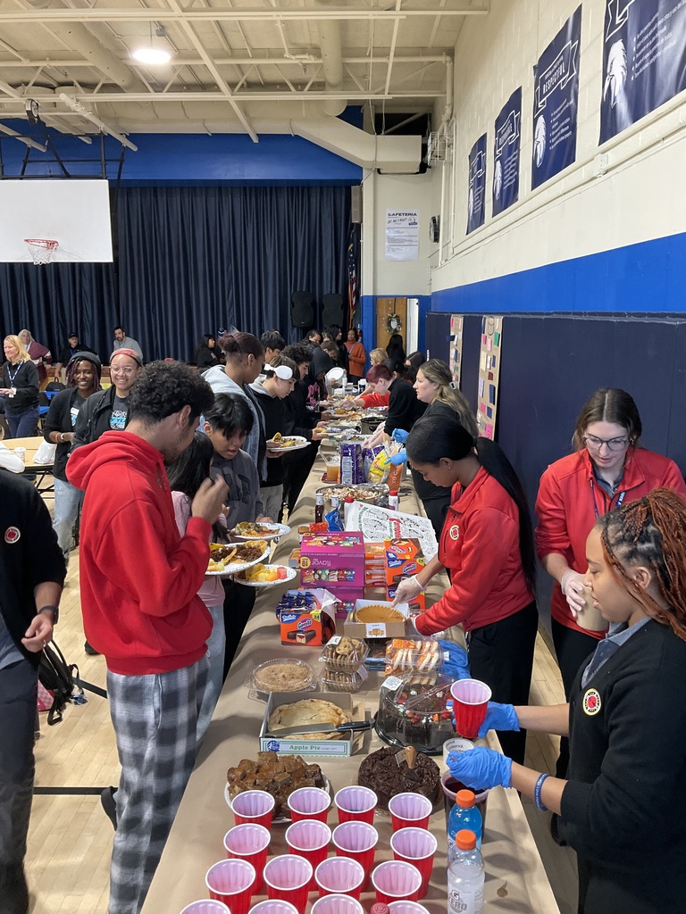 Students are being served Friendsgiving by staff in the cafeteria