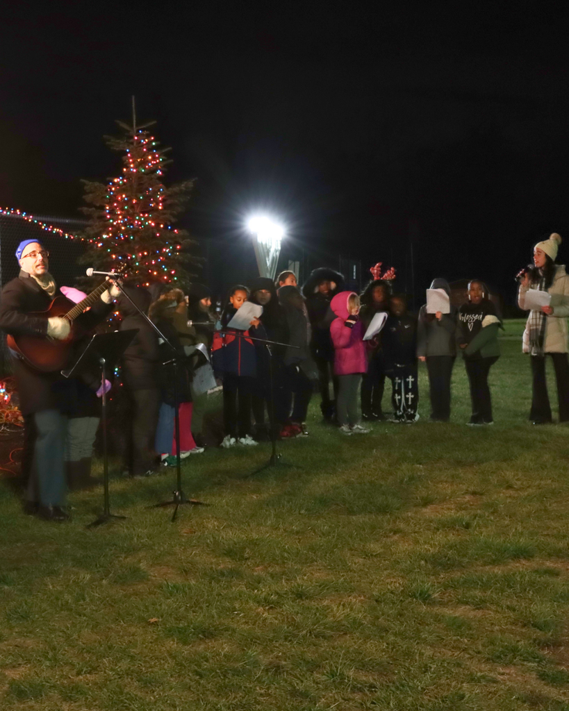 Teachers and students singing holiday songs during Very Merry Sing Along.