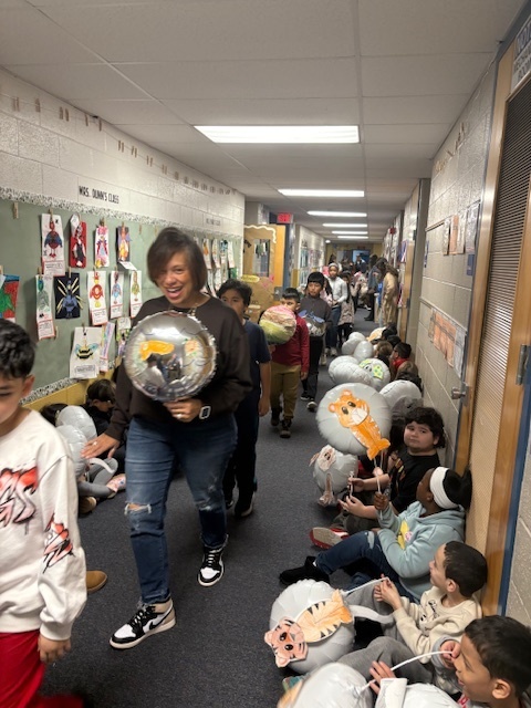 Students participating in the Thanksgiving Parade.