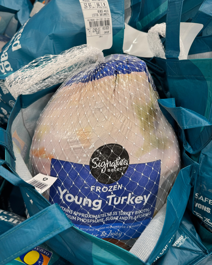Frozen turkey inside reusable shopping bag. 