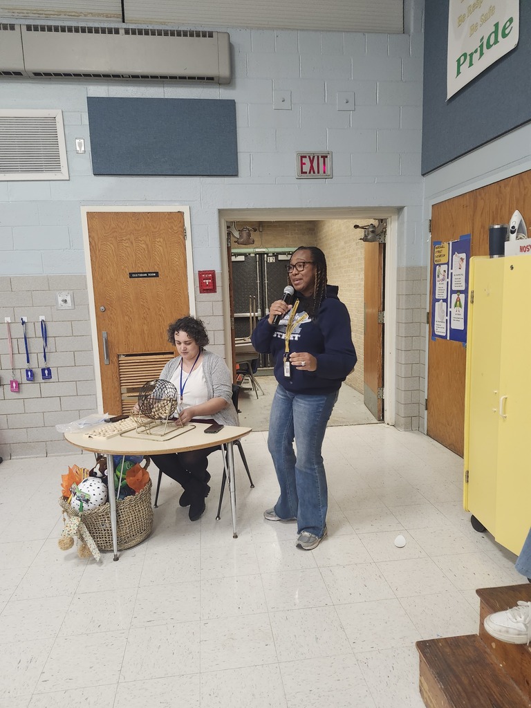 Mrs. Rooney and Mrs. Chester call out Bingo numbers.