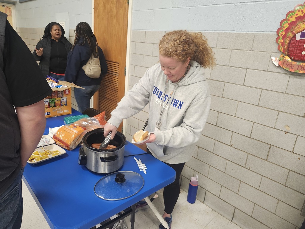 Mrs. Yost serves hot dogs at Bingo night.