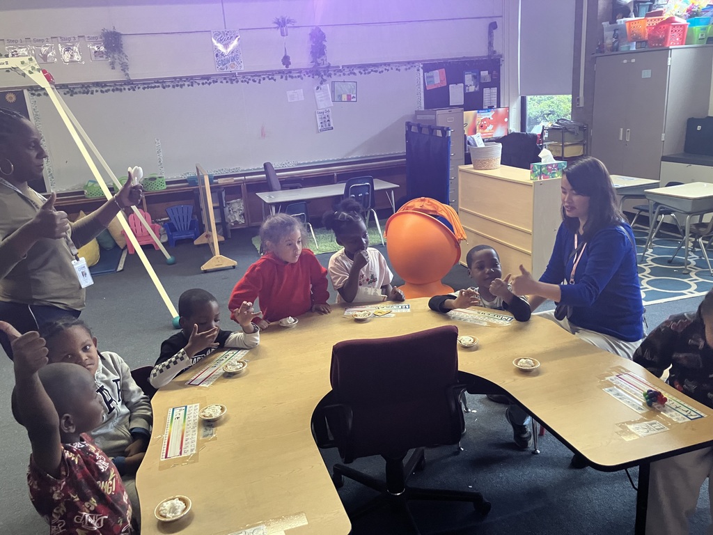 Students make mini pumpkin pies to celebrate Thanksgiving.