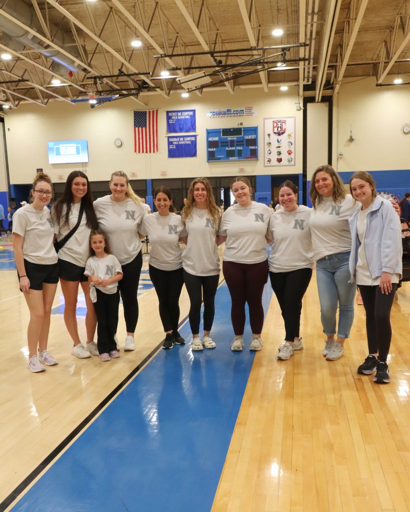 Large group of NASD special education teachers pose for photo in the gym. 