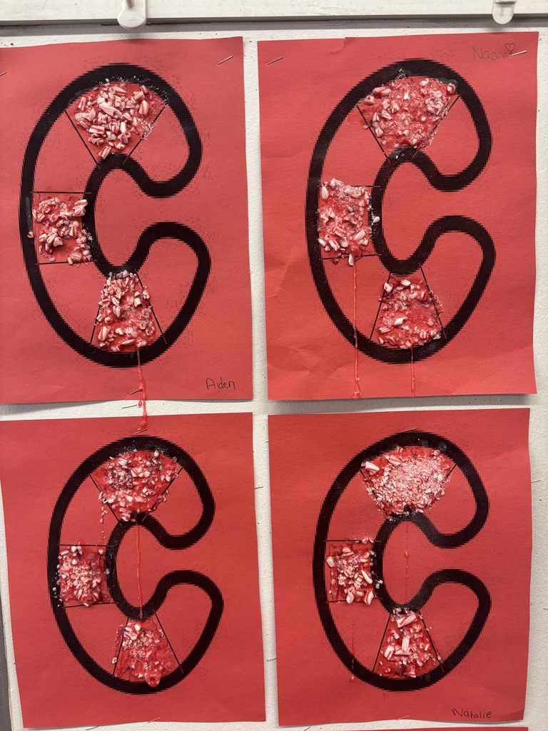 The letter c with crushed candy canes