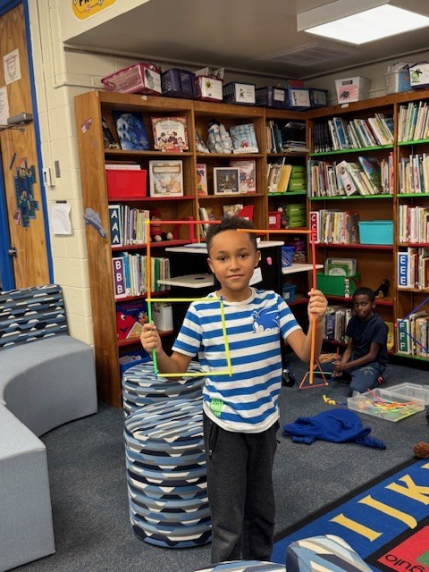 A student making the number 67