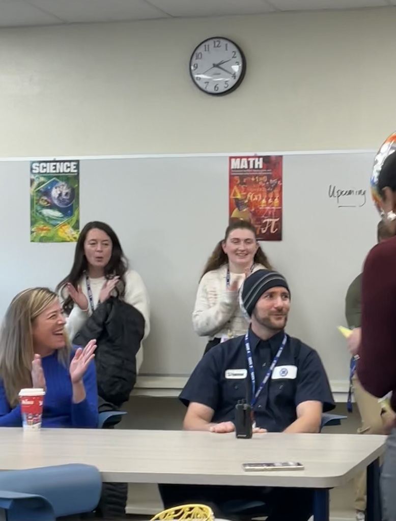 The custodian looks confused after he was named the team member of the month