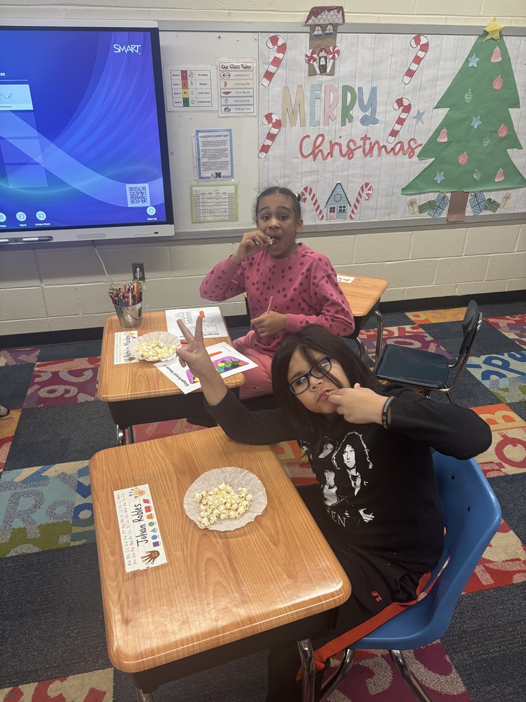 Students eating popcorn at their popcorn party
