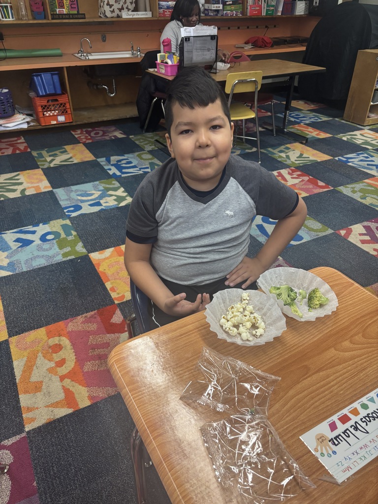 A student eating popcorn and broccoli 