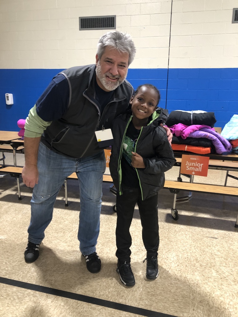 A student warm and cozy in his new coat