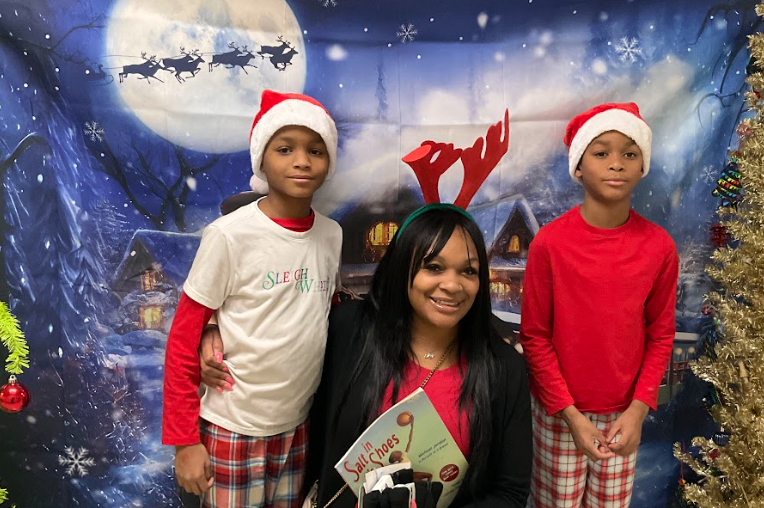 A family taking a photo at Polar Express Night