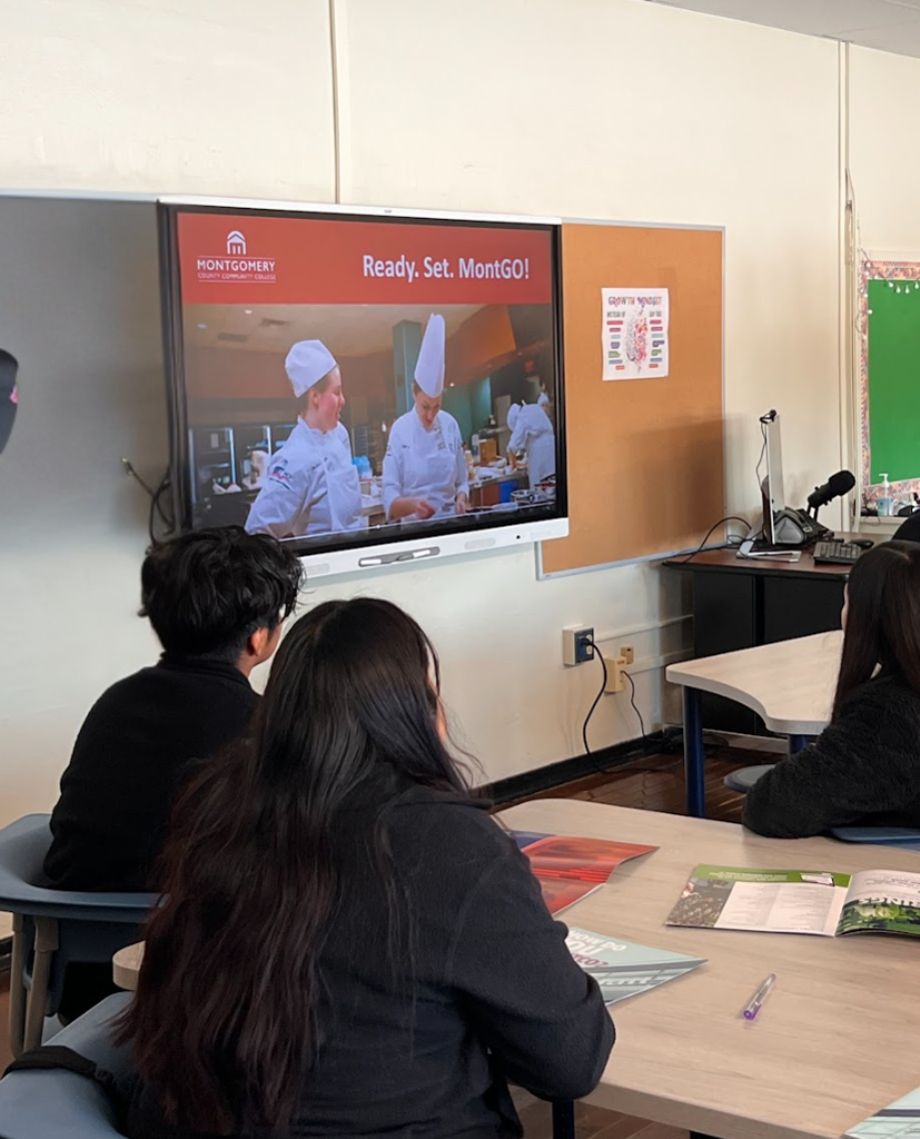 Students are looking at the screen that is about to begin a presentation for MONTCO. m