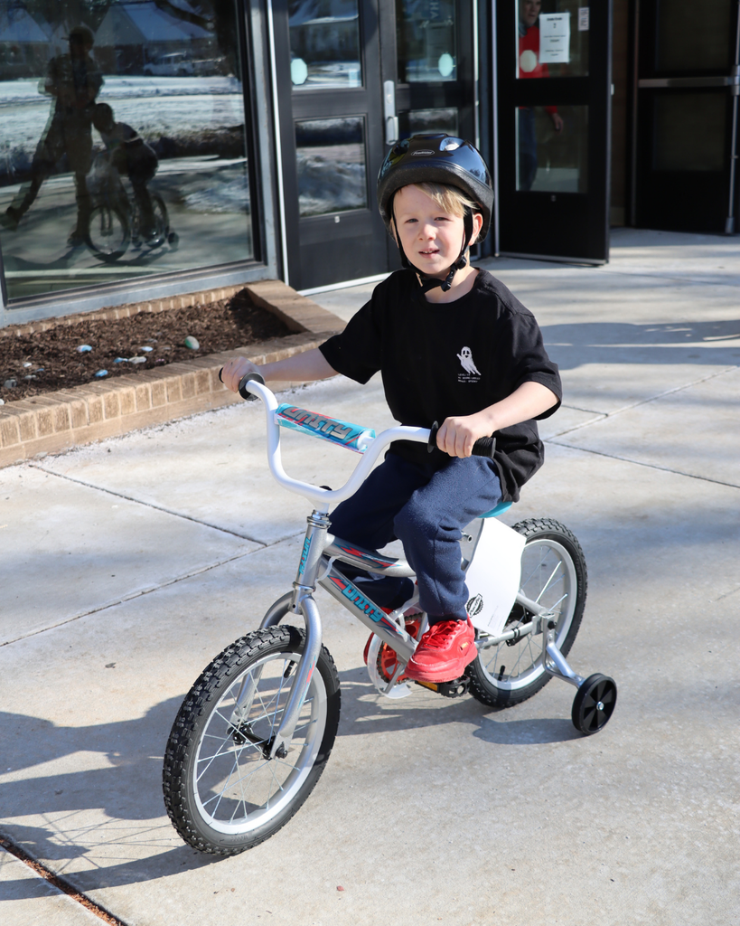 Student riding their new bike. 
