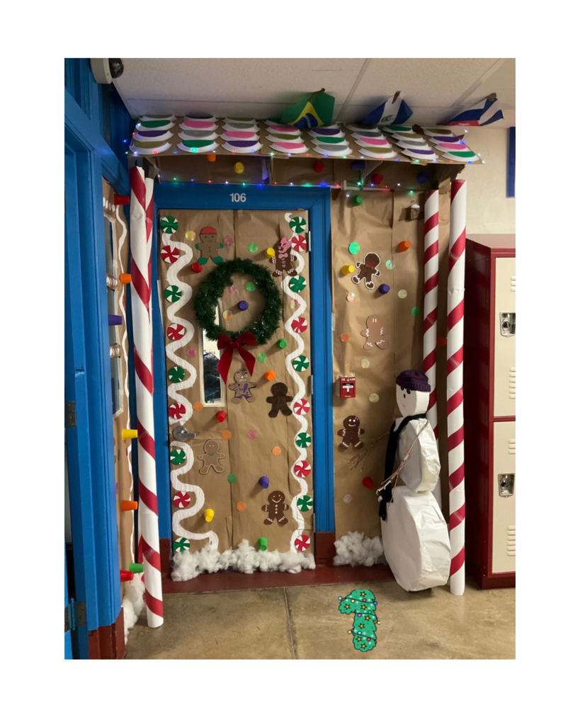 A very colorful gingerbread house is decorated outside the cast classroom