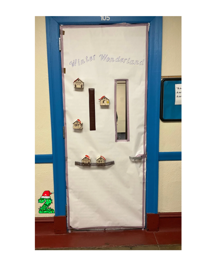 A white door with some houses on it and it bags winter wonderland