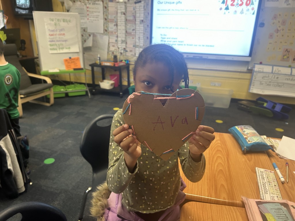 A student working on a yarn heart