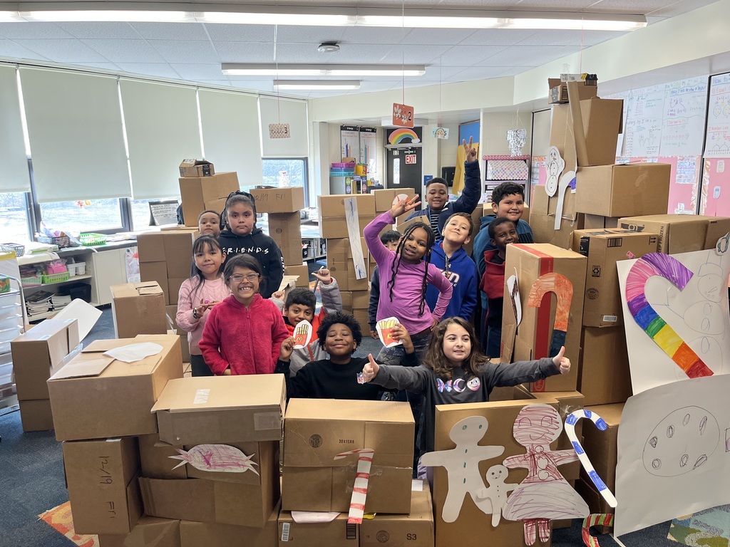 Third grade with their life size gingerbread house
